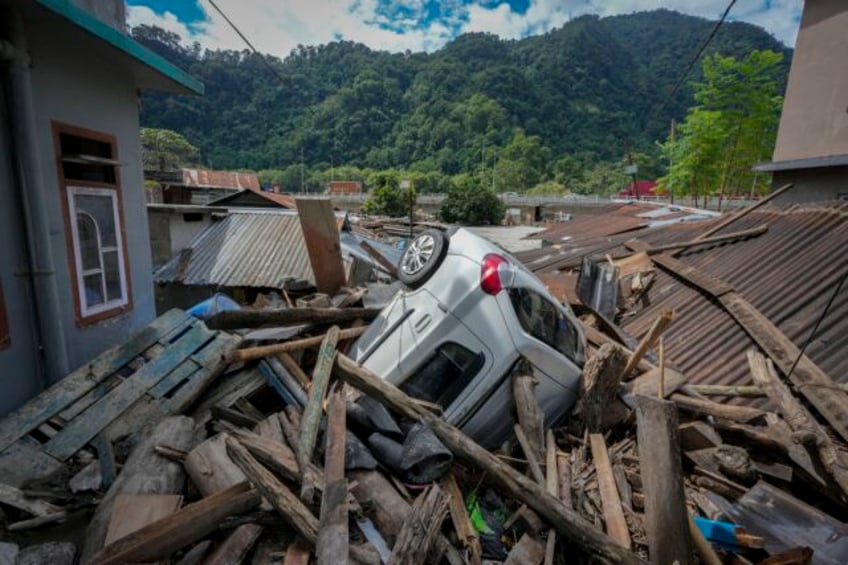 indian rescuers are flying into the region where a flood washed out bridges and killed at least 74