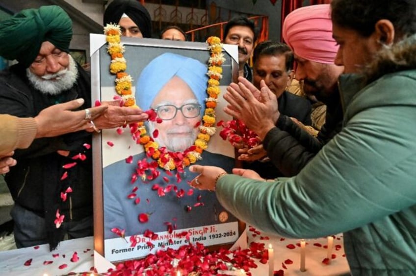 Members of Congress party pay homage to India's former prime minister Manmohan Singh, cons