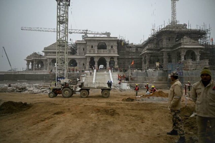 Security personnel stand guard at the construction site of a temple to Hindu deity Ram in Ayodhya, India