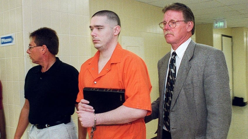 Joseph Corcoran is led to the City-County Lockup on Aug. 26, 1999, in Fort Wayne, Ind., after being sentenced to death in the slayings of four people in July 1997.