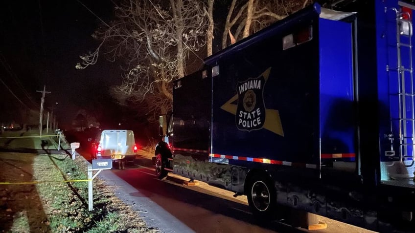 A nighttime image of an Indiana State Police truck tending to a fire