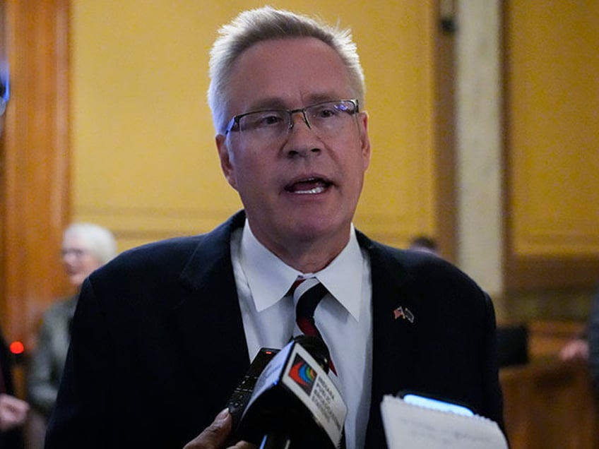 Plaintiff John Rust speaks with reporters following oral arguments before the Indiana Supr