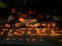 Indians demand justice in candlelight march for murdered doctor