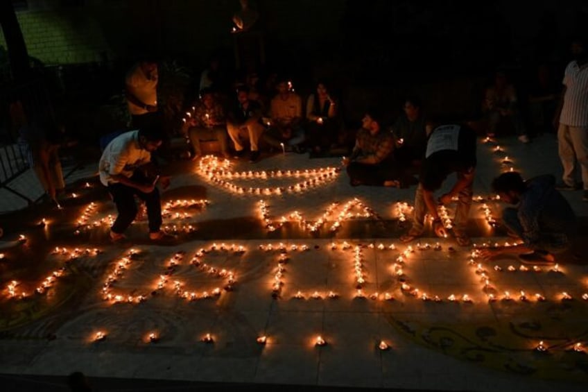 Health professionals light up earthen lamps in Kolkata calling for justice after the rape