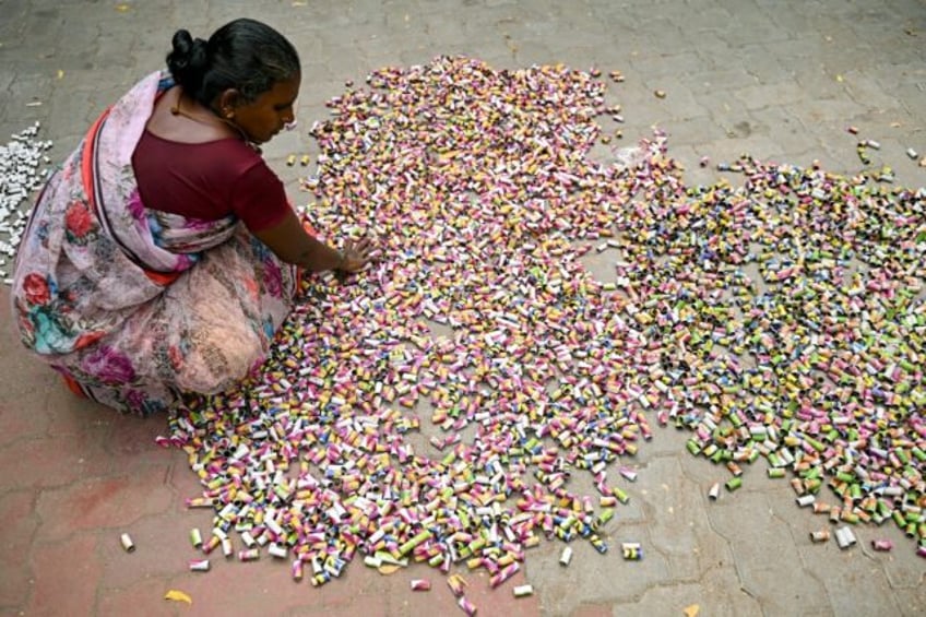 Indian workers prepare fireworks ready for the Hindu festival of Diwali on November 1 -- b