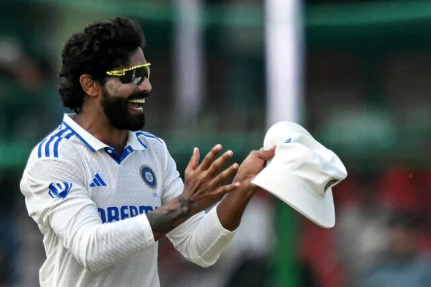 India's Ravindra Jadeja celebrates after taking the wicket of Bangladesh's Khaled Ahmed --