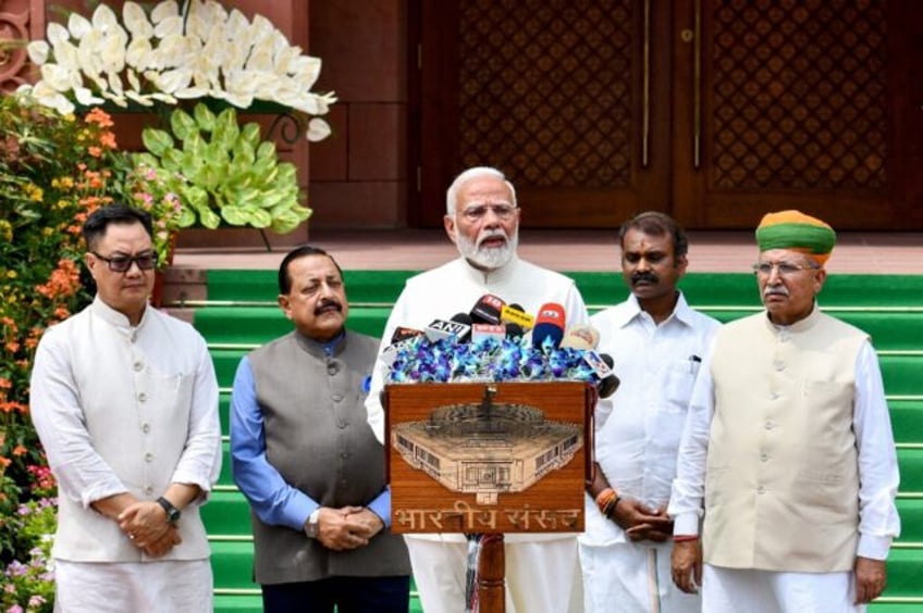 India's Prime Minister Narendra Modi speaks to reporters before the opening of the first p