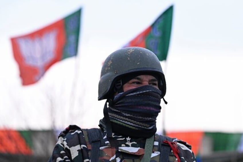 An Indian security officer stands guard outside the venue where India's Prime Minister Nar