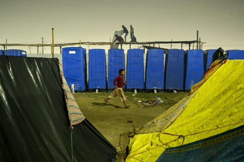 Millions of pilgrims at India's Kumbh Mela festival rely on toilet workers from the lowest