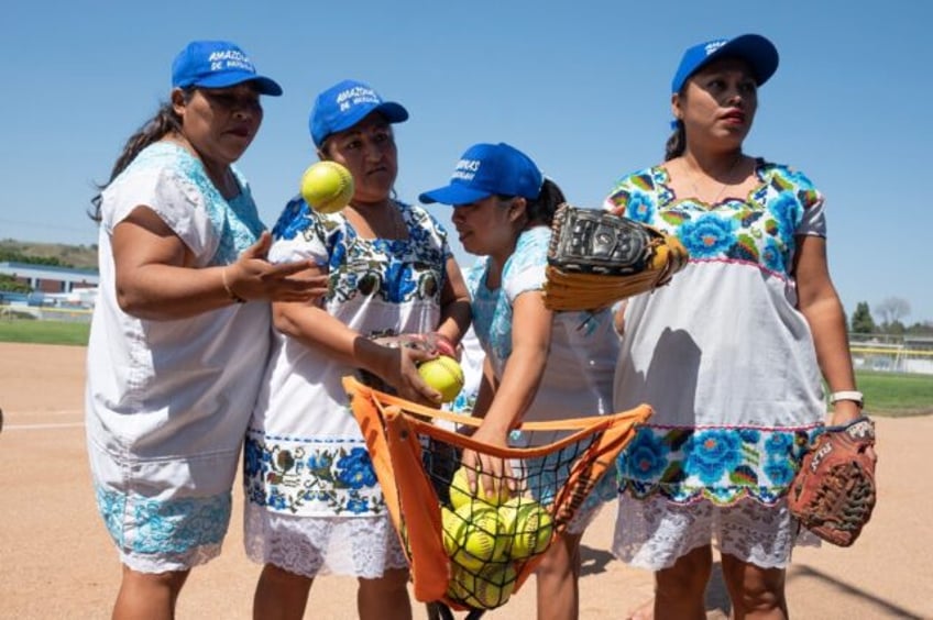 Taking up bats against "machismo": Members of "Las Amazonas de Yaxunah," a women's softbal