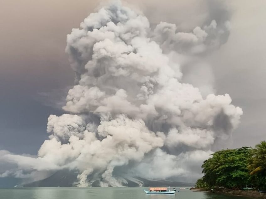 An eruption from Mount Ruang volcano is seen from neighbouring Tagulandang island