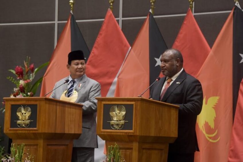 Indonesia's president-elect Prabowo Subianto (L) told Papua New Guinea Prime Minister Jame