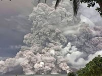 Indonesia’s Ruang volcano spits more hot ash after eruption forces schools and airports to close