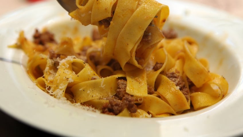 Hand-made fettuccine served with ragu meat 