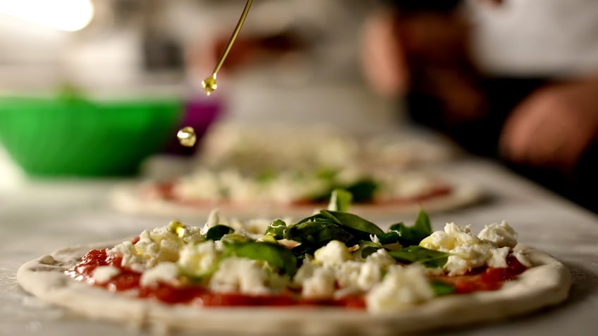 A pizza being made at pizzeria Sorbillo in Naples