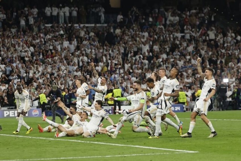 Real Madrid's players celebrate victory at the end of the Champions League semi-final seco