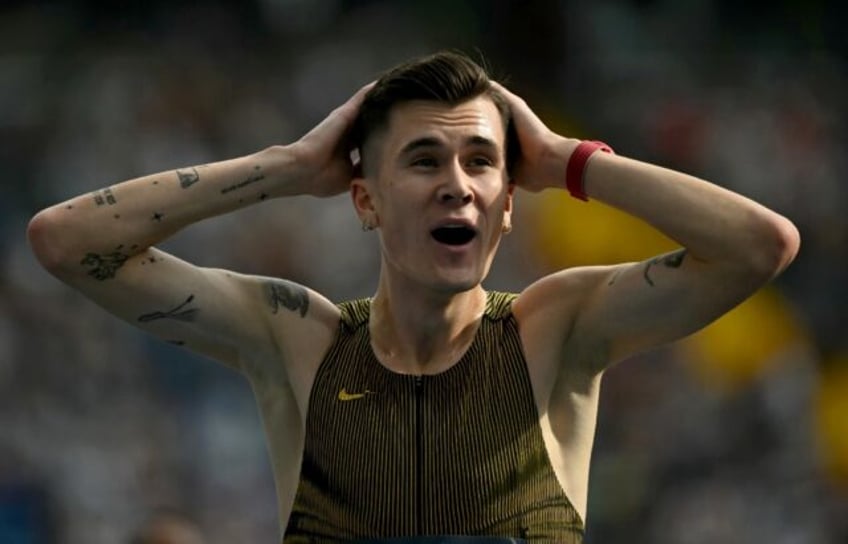 Norway's Jakob Ingebrigtsen reacts after setting a new world record in the men's 3000m at