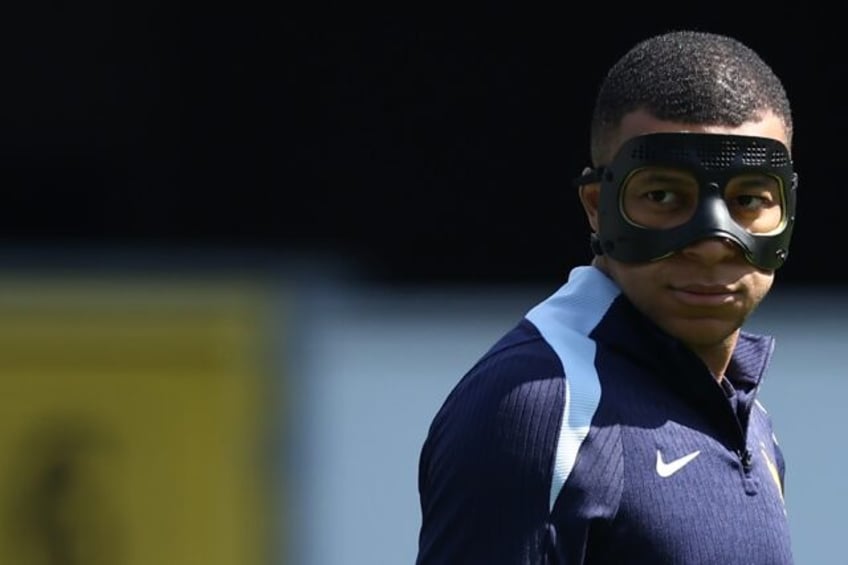 Kylian Mbappe with his protective mask on in training on Monday