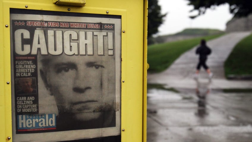 A newspaper on display showing Whitey Bulger caught