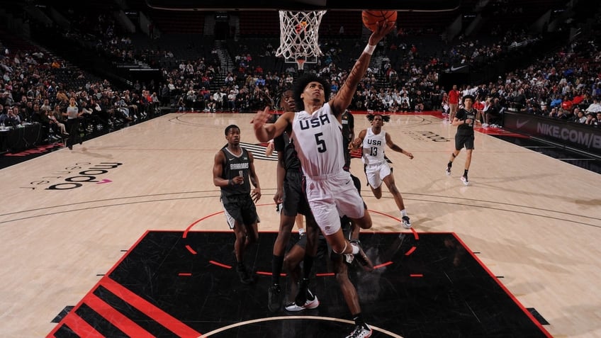 Dylan Harper of Team USA drives to the basket during the game against Team World during the 2024 Nike Hoop Summit on April 13, 2024 at the Moda Center Arena in Portland, Oregon.