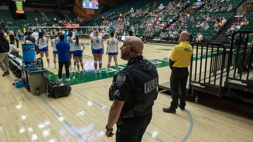 Police behind the San Jose State University Spartans bench monitor Moby Arena during an NCAA Mountain West women’s volleyball game between the Spartans and the Colorado State Rams in Fort Collins, Colorado, on Thursday, October 3, 2024.