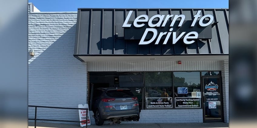 instructor at colorado driving school plows through front of businesss building