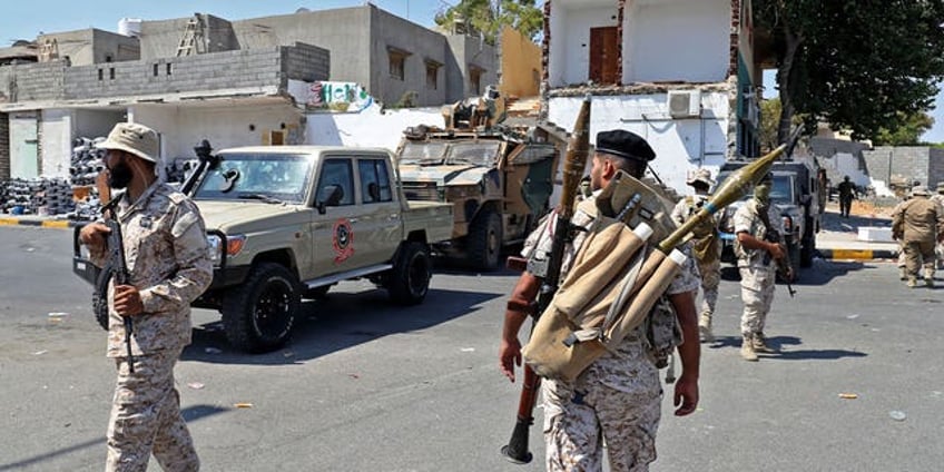 intense clashes between militias in libya leave residents trapped in homes