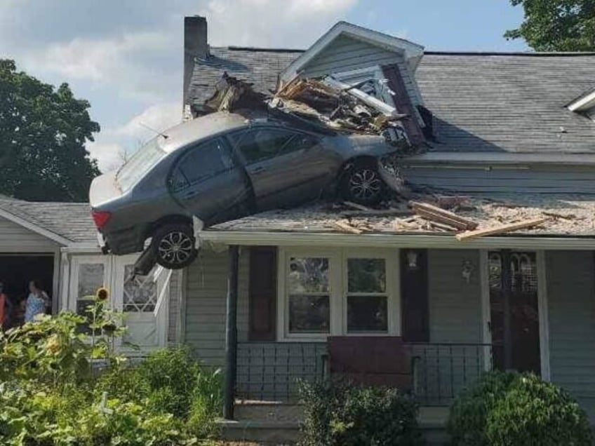 intentional act driver crashes car into second story of home