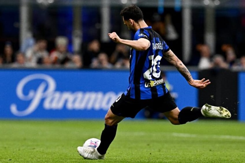 Spot on: Inter Milan's Hakan Calhanoglu scores from the penalty spot