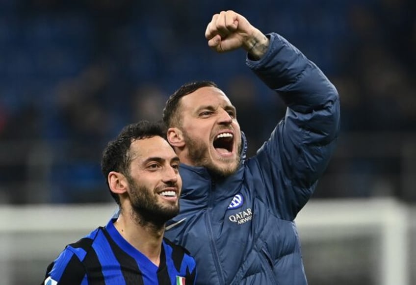 Inter Milan's Hakan Calhanoglu (L) and Marko Arnautovic (R) both scored in a come-from-beh