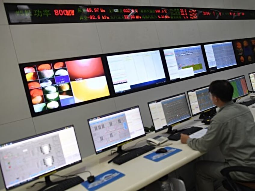 WUHAN, CHINA - JULY 04 2024: A worker monitors operations at a coal-fired power plant in W