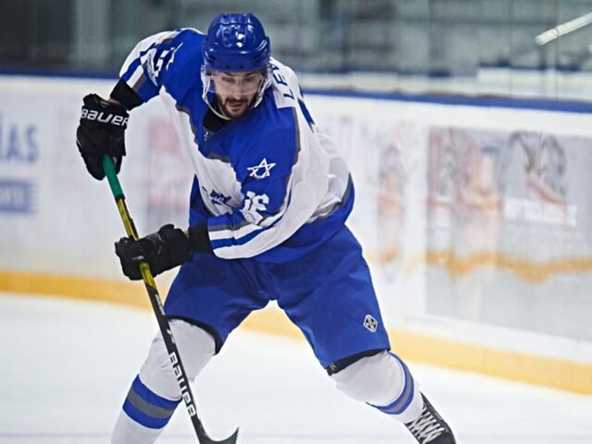 MADRID, SPAIN - APRIL 17: #16 David Levin of Israel and #5Semen Kharizov of Georgia during the IIHF Ice Hockey World Championship In Madrid match between Israel and Georgia at Palacio de Hielo on April 17, 2023 in Madrid, Spain. (Photo by Borja B. Hojas/Getty Images)