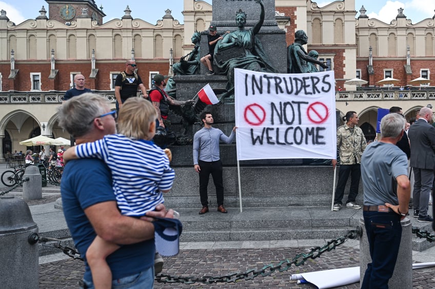 KRAKOW, POLAND - JULY 19: Supporters of the far right political group, Confederation, take part in an anti-immigration protest in Krakow, Poland on July 17, 2025. More than 70 anti-immigration protests take place all over the country, as Poland locked the border with Germany and Lithuania to control the illegal immigration. (Photo by Omar Marques/Anadolu via Getty Images)
