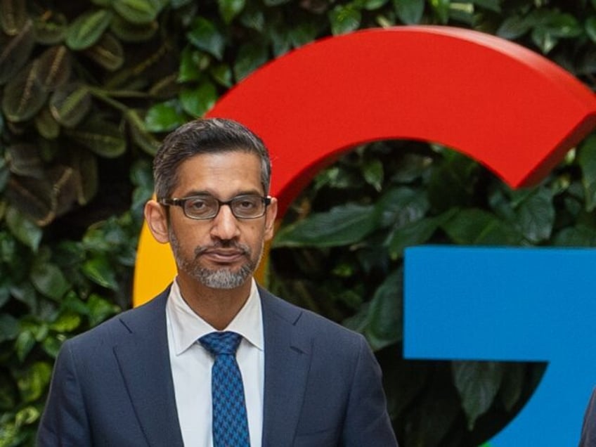 Sundar Pichai poses with the Google G