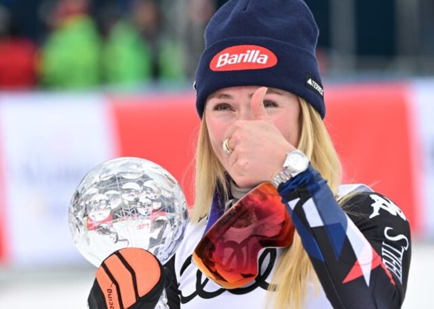 Thumbs up: Mikaela Shiffrin with her slalom globe after taking her World Cup tally to 97