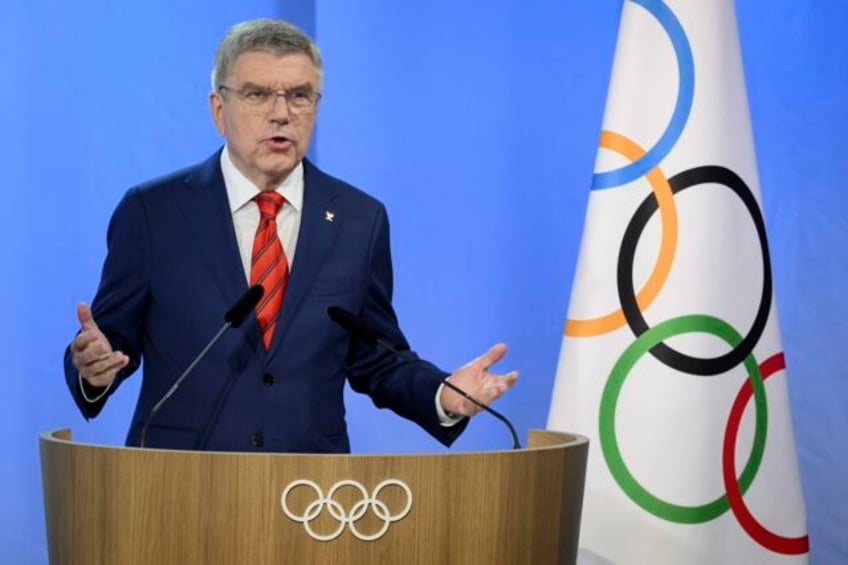 iocs bach says key to russian decision for paris olympics is athletes respectful conduct