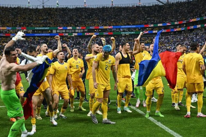 Romania celebrate qualifying for the Euro 2024 last 16