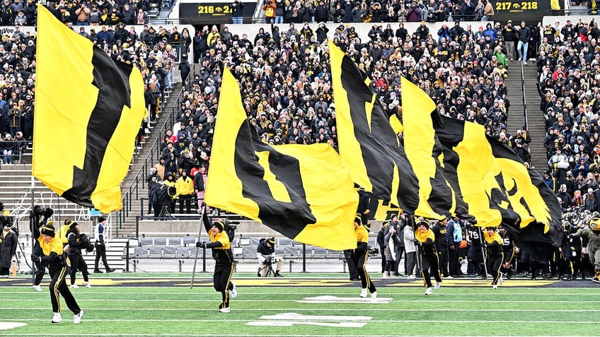 iowa cheerleaders pants fall to ankles during backflip still sticks landing