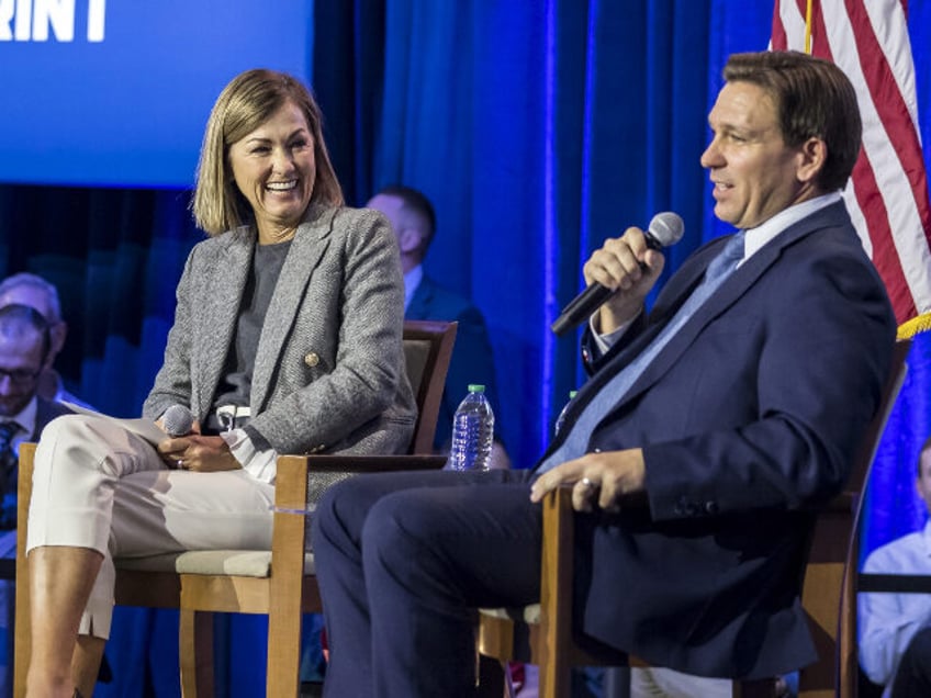 iowa gov kim reynolds formally endorses ron desantis he puts this country first and not himself