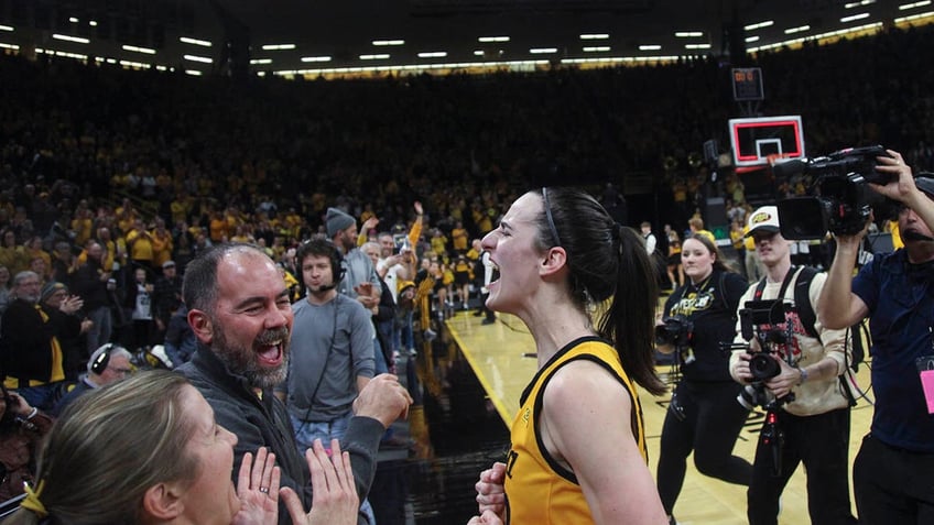 Caitlin Clark celebrates after a win