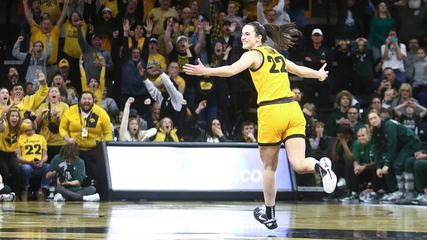 Caitlin Clark celebrates after scoring