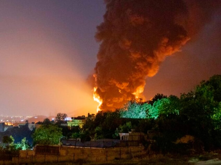 TEHRAN, IRAN - JUNE 15: Fire and smoke rise into the sky after an Israeli attack on the Sh