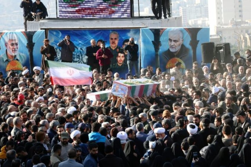 The funeral in Tehran for three Islamic Revolutionary Guard Corps members killed in Syria -- Iranian media reported the victims included the IRGC's intelligence chief for Syria, and his deputy