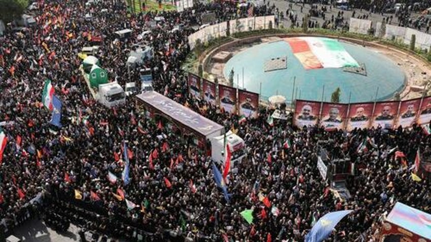 iran holds huge public funeral for slain military commanders scientists