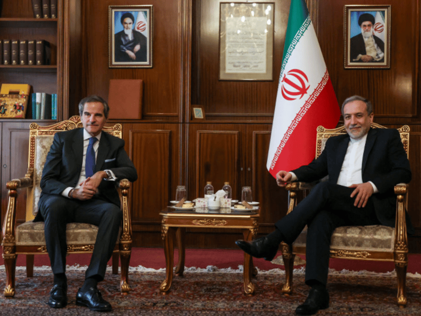 Iran's Foreign Minister Abbas Araghchi (R) and International Atomic Energy Agency (IAEA) D