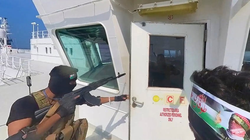 Houthi fighter aboard a cargo ship