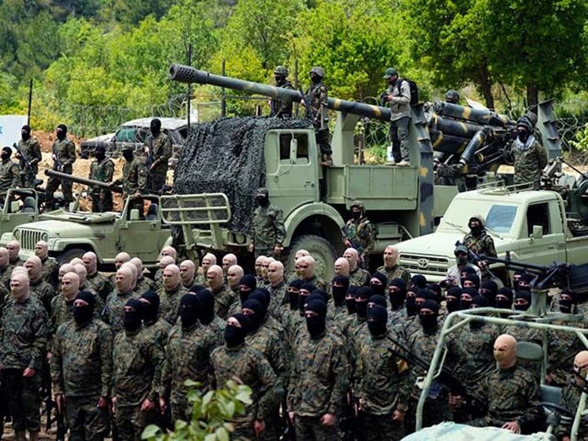 Fighters from the Lebanese militant group Hezbollah carry out a training exercise in Aaram