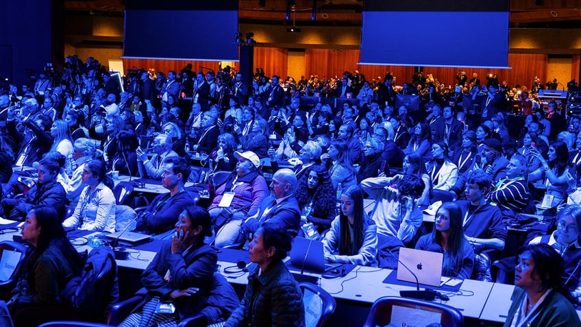 A crowd of people at a summit in Geneva