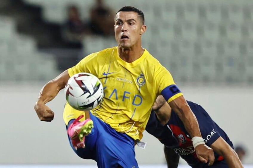 iranian soccer fans flock to cristiano ronaldos hotel after he arrives in tehran with saudi team