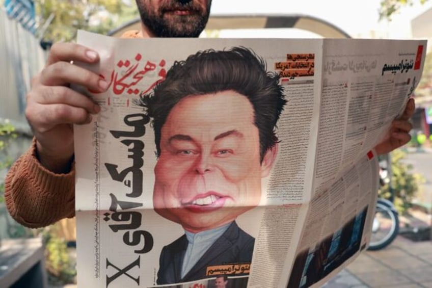 An Iranian with the daily newspaper Farhikhtegan which printed a cartoon of Elon Musk on i